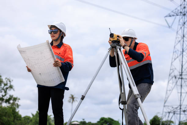 istock Engineer use theodolite equipment and Blueprint surveying construction worker on Railway site. 1735375197