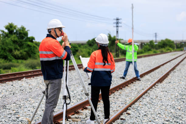 istock Engineer use theodolite equipment and Blueprint surveying construction worker on Railway site. 1735375749