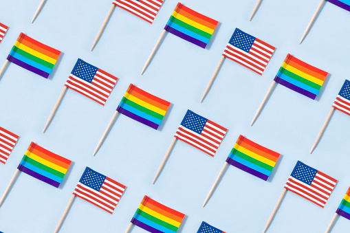 Rainbow flag with America flag on blue background