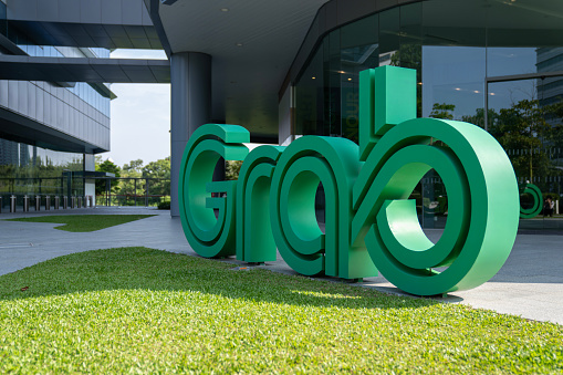 Singapore, Singapore - October 14, 2023: Logo outside ride-hailing and food delivery app Grab's headquarters in One-north.
