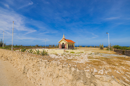 Aruba. Oranjestad. 10.16.2023. View of Caribbean coast with small Catholic chapel known as 