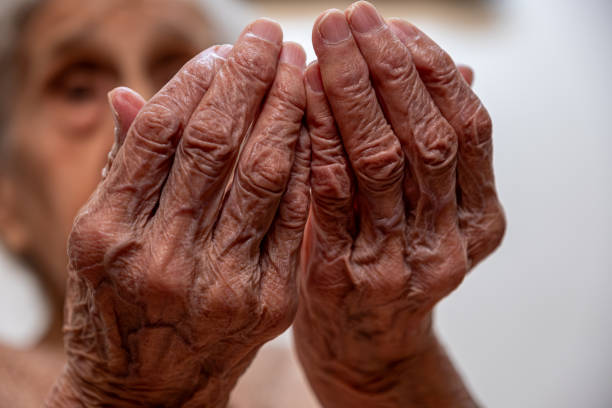 istock Old woman hands praying for god rising her hands 1735403592