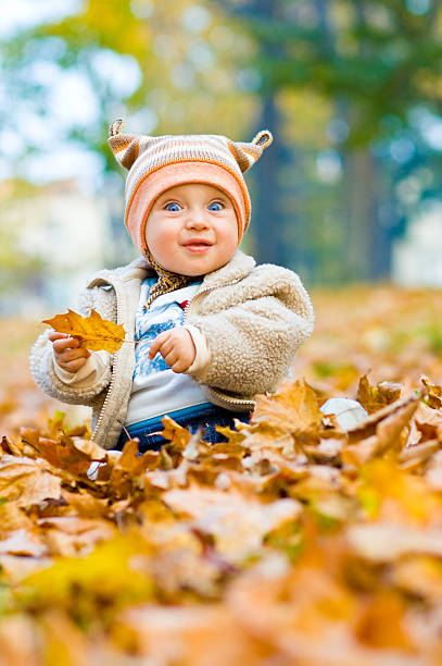 Smiling baby in park stock photo