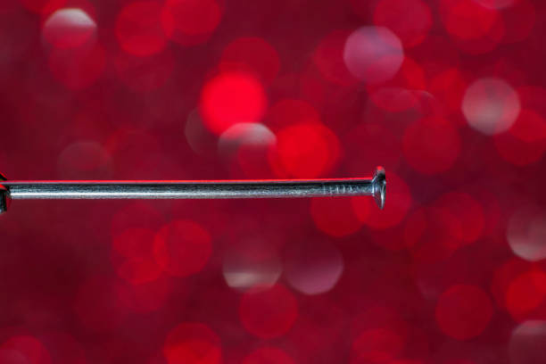 Nail for blurred background photographed with lens flare in the studio
