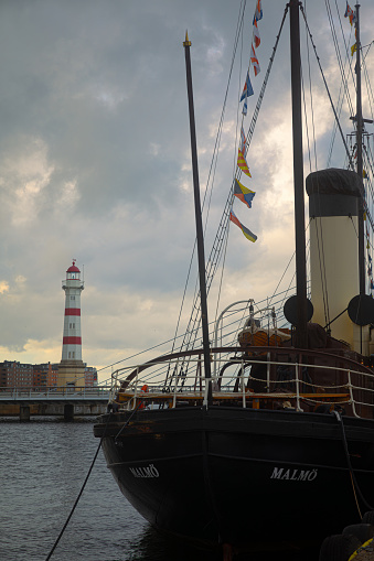 Greenwich, London, England - 9 September 2014: A Sailing Ship on the Thames River with the city of London in the background in London, England.