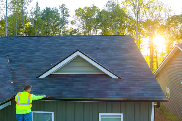 istock Service man maintenance gutter cleaning with fallen leaves 1735405660