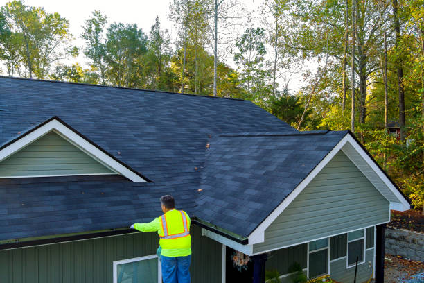 istock This is worker cleaning clogged roof gutter drain from dirt, debris, fallen leaves 1735405773