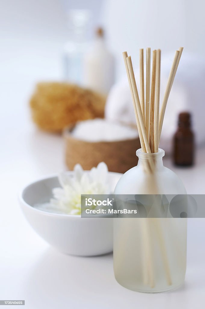 spa aromatherapy on white Reed diffuser and floating flower with bath items in the background. You may also like: Bathroom Stock Photo