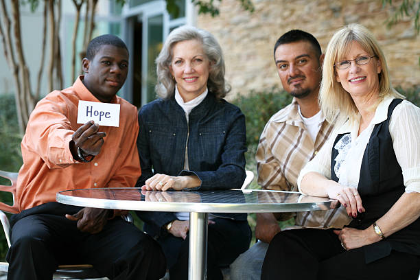istock Group Of people Holding Up A HOPE Sign 173540687