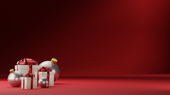 Front view of a group of three christmas gift boxes and christmas balls with copy space on red background. 3D Render.