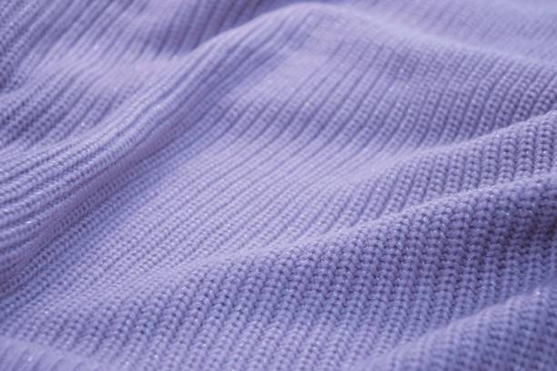 istock Lilac purple knitted woolen sweater fabric. Abstract background. 1735408761
