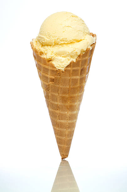 Vanilla Ice Cream Cone Vanilla ice cream in a waffle cone against a pure white background and cool blue fade at bottom. More ice cream: cone shape stock pictures, royalty-free photos & images