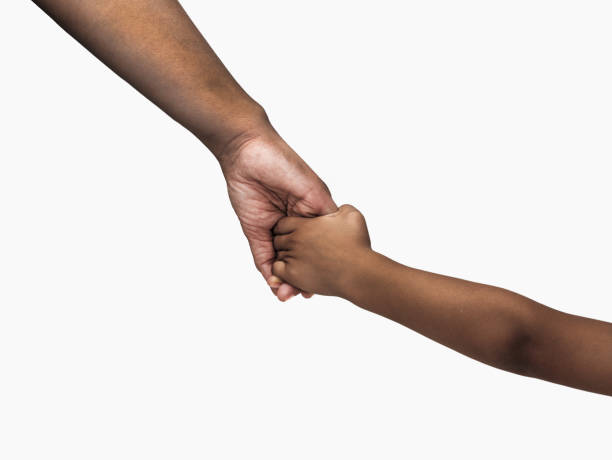 mother giving a hand to her child Close-up a mother giving a hand to her child isolated on white background kid holding fathers hand stock pictures, royalty-free photos & images