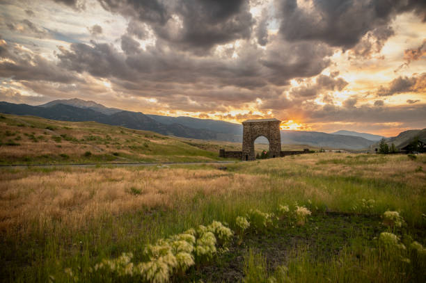 istock Sunset Behind Roosevelt Arch In Gardiner Montana 1735411164