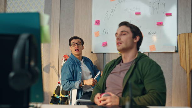 istock Creative team video chatting online in office closeup. Two colleagues videocall 1735411933