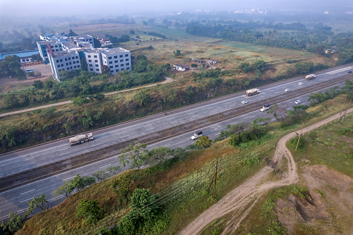 Pune, India - October 14 2023: Traffic on the Mumbai Pune Expressway near Pune India. The Expressway is officially called the Yashvantrao Chavan Expressway.
