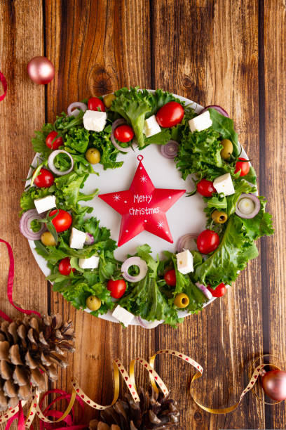 istock Christmas wreath salad on dark background 1735412831