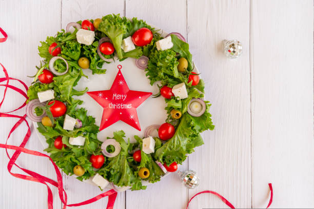 istock Christmas wreath salad on dark background 1735412896