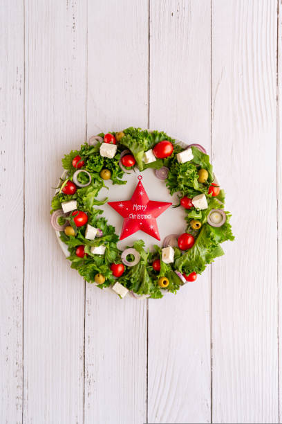 istock Christmas wreath salad on dark background 1735412936