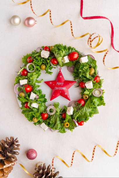 istock Christmas wreath salad on dark background 1735413002