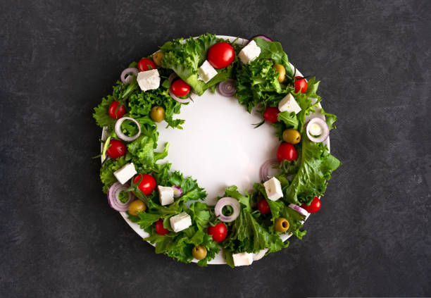 istock Christmas wreath salad on dark background 1735413855