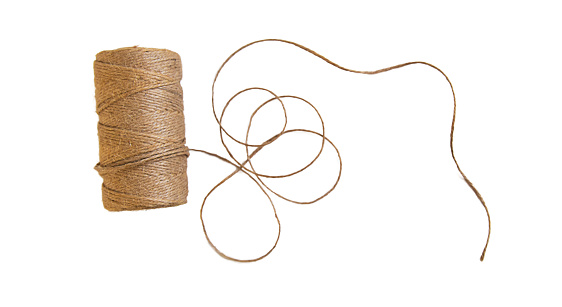 A big spool of white sewing thread isolated on white background (with clipping path)