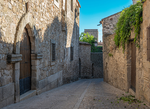 A pedestrian and cobbled street in the medieval and historic town of Trujillo, Spain