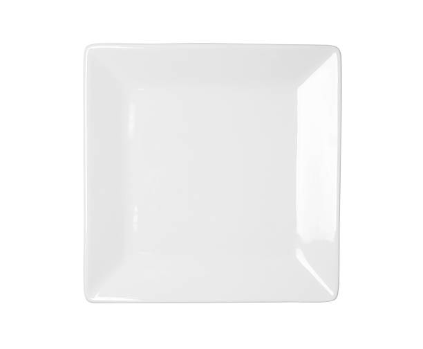 White square plate on a white background stock photo