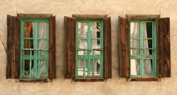 istock Three old timber Windows with wooden shutters 173542086