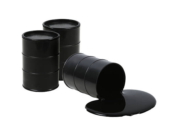 Oil barrels Three barrels with one spilled. drum container stock pictures, royalty-free photos & images