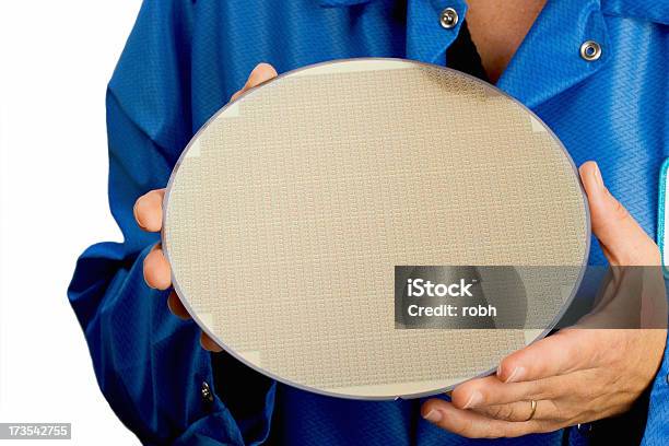 Person In Blue Holding A Large Silicone Wafer Stock Photo - Download Image Now - Computer Wafer, Semiconductor, Cool Attitude