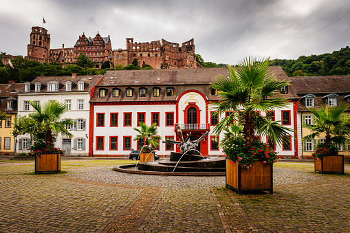 Heidelberg, Germany - August 26, 2023: Karlsplatz with famous ruin of the castle of Heidelberg in Germany in background