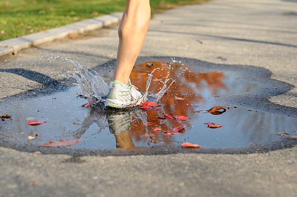 Running Through Puddle stock photo