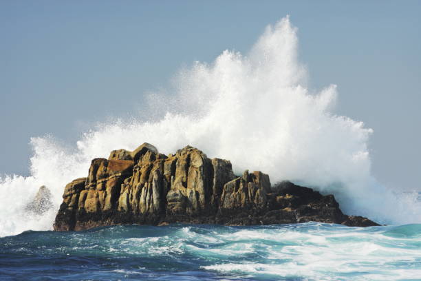 Ocean Wave Crashes Rock Surf Spray stock photo
