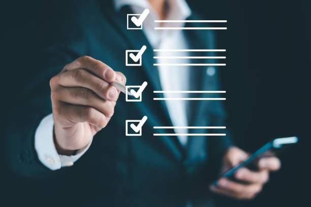 istock Business performance checklist, businessman using smartphone, taking survey, online checklist, filling out checklist, digital form 1735449831