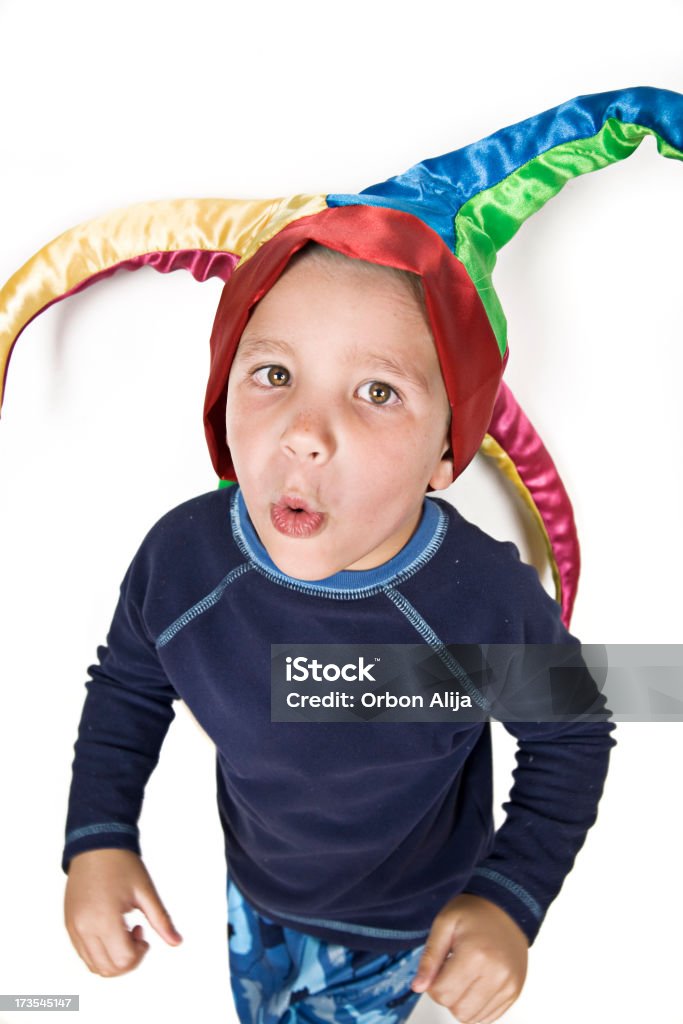 playful child dress up with an harlequin hat Boys Stock Photo