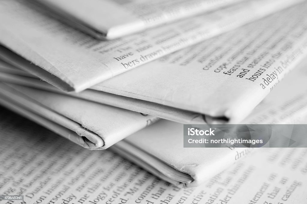 Stack of newspapers Close up of a stack of newspapers. Shallow depth of field. Black And White Stock Photo