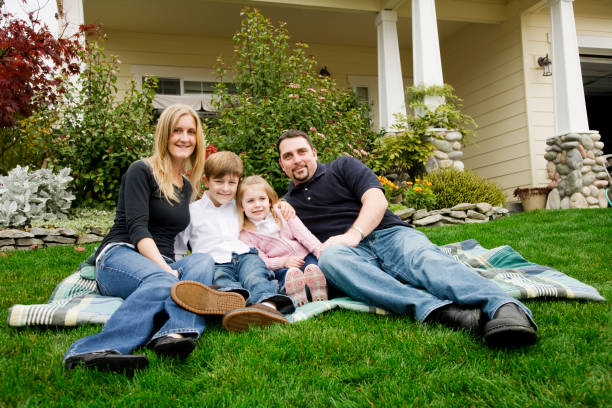 istock Family of Four at Home in Front Yard 173545541