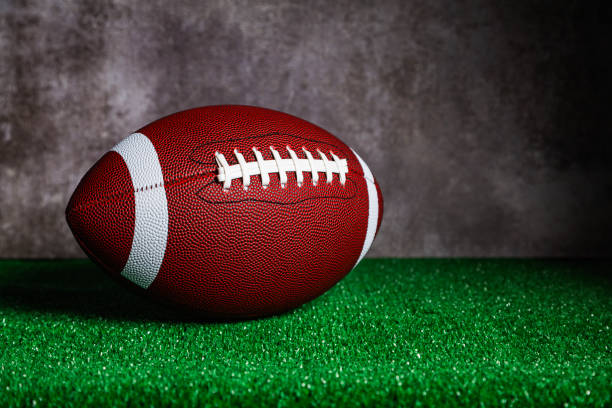 istock An American Football ball over grass 1735456202