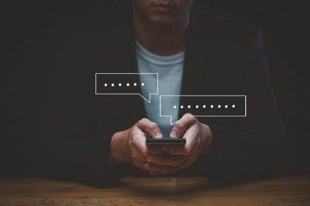 istock men hand using smartphone typing Live chat chatting and social network concepts, chatting conversation working at home in chat box icons pop up. Social media marketing technology concept. 1735463590