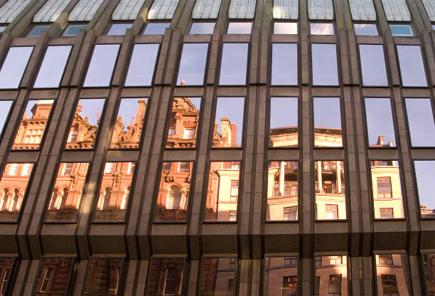 istock Old architecture reflected in a new building's windows 173546559