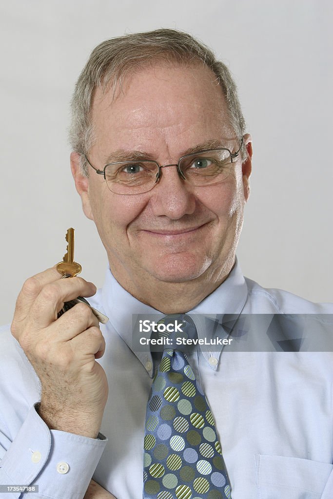 Homme avec une clé - Photo de Acheter libre de droits