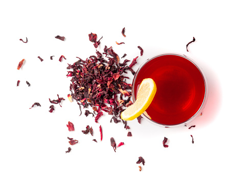 Hibiscus Tea in Glass Cup Isolated, Dry Rose Drink, Cold Fruit Red Tea, Karkade in Transparent Mug, Hot Herbal Drink, Roselle Hibiscus Tea on White Background Top View