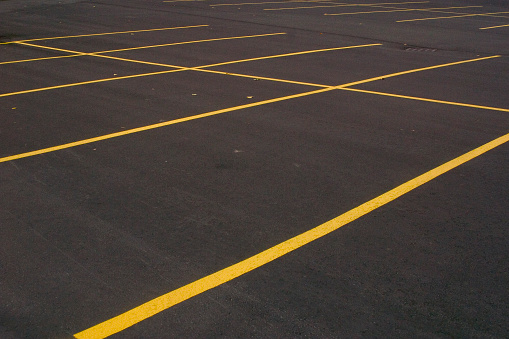 A freshly paved and painted parking lot. Great contrast between lines and asphalt.
