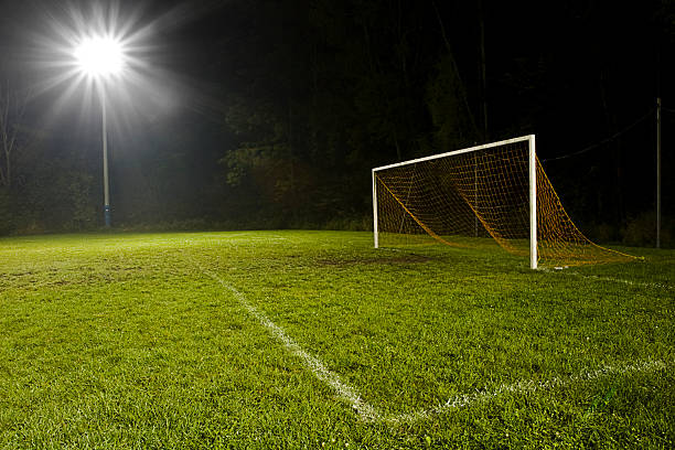 istock A soccer field at night lit up by a floodlight 173548484