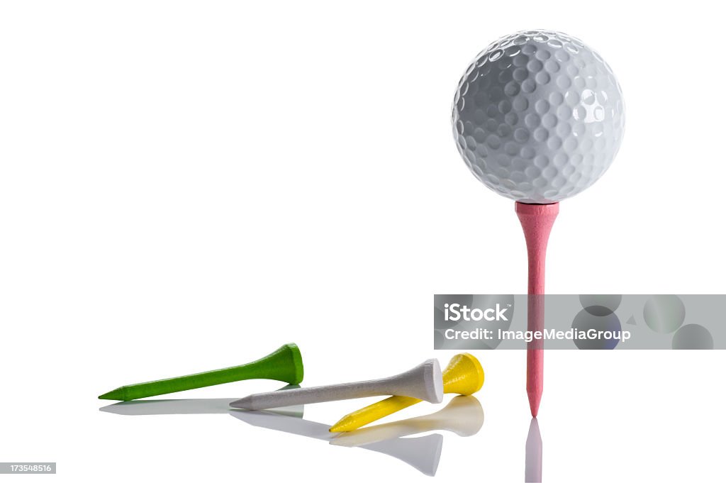 Colorful Tees and Golf Ball Golf ball sitting on tee with three tees lying down isolated on white Tee - Sports Equipment Stock Photo
