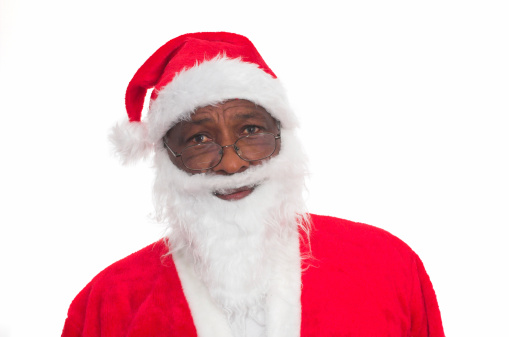 Old black man dressed up as Santa Claus.