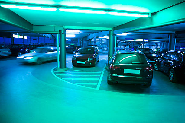 Illuminated Parking Garage with Cars