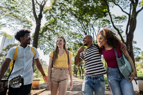istock Student friends having fun at university campus outdoors 1735494159