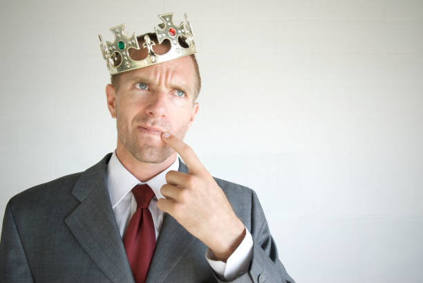 istock Royal Businessman Wearing Crown Thinking Hard 173549916